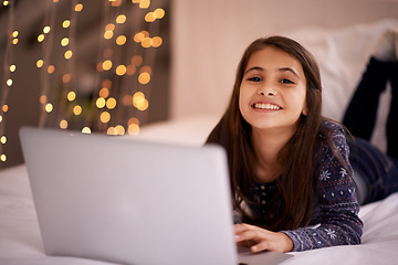 Image showing Night, laptop and portrait of girl on a bed for cartoon, search or google it sign up at home. Computer, search and face of kid person in a bedroom with movie streaming, service or Netflix and chill