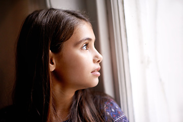 Image showing Thinking, window and face of child in home for relaxing, rest and calm on weekend. Youth, ideas and face of young girl by glass for view, thoughtful and reflection for happiness, playing or childhood