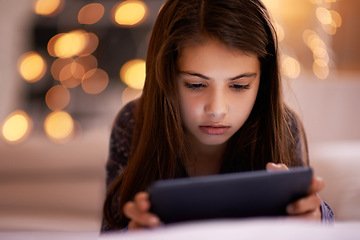 Image showing Home, night or kid with tablet for streaming, playing games or watching fun videos on movie website. Girl, house or young female child with technology to download online or social media app to relax