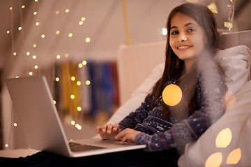 Image showing Portrait, night or child with laptop for streaming, playing games and watching videos on a movie website. Smile, house or happy kid with technology to download online or social media app to relax