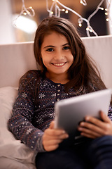 Image showing Girl in portrait, kid and tablet, tech and communication with ebook for reading and social media at home. Elearning, movie or storytelling app with internet, browsing and digital platform for gaming