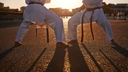 Image showing People, karate and legs with martial arts in self defense, class or teaching in the city street. Outdoor fighter, athlete or sparring partner in fitness training, kata or technique in an urban town