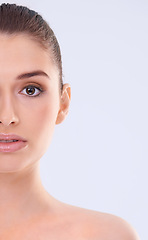 Image showing Beauty, skincare and half portrait of woman with confidence, mockup and facial cosmetics in studio. Dermatology, health and face of girl with natural makeup, glow and skin care on white background