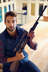 Image showing Hunter, weapon and portrait of man with gun for game shooting, adventure and hobby with confidence. Sports home and serious face of person in cabin with rifle, pride and sportswear for hunting