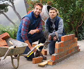 Image showing Construction, bricklayer in portrait and men with brick wall, handyman or contractor with trade, mentor and apprentice in industry. Team, builder and tools, maintenance and renovation for training