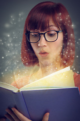 Image showing Glowing pages, book and woman with a story, magic and education on grey studio background. Person, reader and girl with a novel and literature with knowledge and imagination with fantasy or astrology