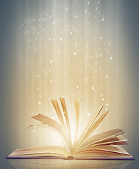 Image showing Magic, glowing pages and story with book, glitter and literature on a grey studio background. Empty, education and art with creativity and lights with novel and knowledge with astrology and sparkle