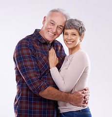 Image showing Studio, hug and portrait of senior couple for bonding, affection and loving relationship. Marriage, happy and mature man and woman embrace for commitment, trust and care on white background together