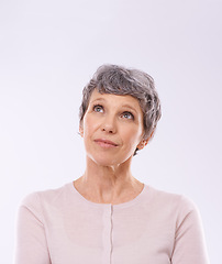 Image showing Thinking, idea and senior woman in studio with mockup for faq, brainstorming or promo on white background. Questions, planning and old lady model curious about announcement, information or deal offer