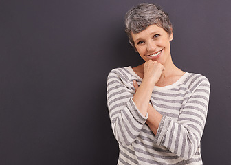 Image showing Portrait, smile and elderly woman with retirement, happiness and casual outfit on a grey studio background. Face, pensioner and old person with mockup space and cheerful with trendy clothes or joyful