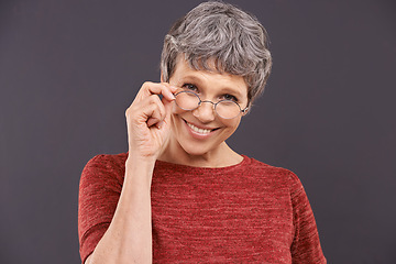 Image showing Happy, portrait and senior woman with glasses in studio for vision, optometry or frame sale on grey background. Eye care, testing or face of old lady model smile for pensioner, spectacles or discount