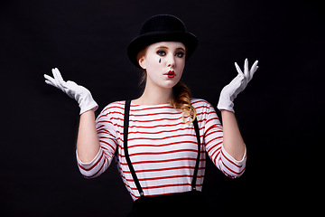 Image showing Woman, costume and mime for performance in studio on dark background with creative makeup for entertainment and artist. Portrait, female person and outfit with hands up as circus performer.