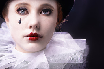 Image showing Face, woman and magician performer in studio on black background with creative makeup for entertainment, artist and passion. Portrait, female person and outfit to perform tricks or jokes at circus