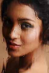 Image showing Wet, beauty or woman face with glass, window or sauna for skin detox, hydration or moisture in studio. Water, makeup or female model with pure, cleanse or cosmetic toner, removal or dermatology steam