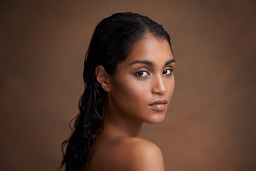 Image showing Hair, wet or portrait of Indian woman in studio for beauty, wellness or shine cosmetics on brown background. Haircare, cleaning or calm lady model face with shampoo, results or scalp detox treatment