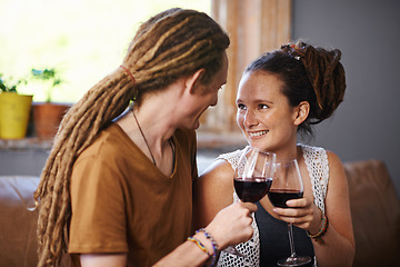 Image showing Couple, wine and cheers for love, romance and joy for romantic, dating and relationship together for unwind. Boyfriend, girlfriend and rasta with glass and smile and relax with drink in lounge