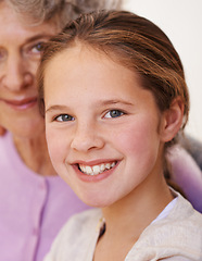 Image showing Portrait, grandma and girl with smile in house, senior and woman babysitting granddaughter in home. Living room, elderly female person and child in lounge with happiness, love and bonding together