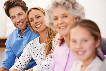 Image showing Generations, portrait and family with smile, home and relax on sofa of living room for bonding. Girl, mother and father with grandma for visit with daughter or child with happiness on couch of house