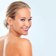 Image showing Happy, skincare and portrait of woman in studio for facial treatment, dermatology and cosmetic glow. Female person, smile and confidence with healthy skin, self care and wellness on blue background
