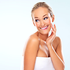 Image showing Woman, beauty and satisfaction for skincare in studio with cosmetics, self care and facial treatment. Model, person and happy for glowing skin, cosmetology and relax and mockup on white background