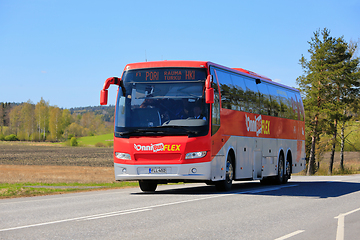 Image showing Red OnniBus FLEX Coach Bus Transports Passengers