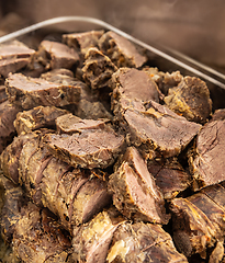 Image showing Juicy pieces of slow-cooked beef brisket