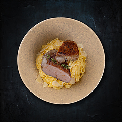 Image showing Gourmet pork belly with pasta