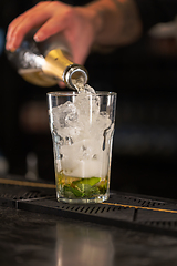 Image showing Bartender preparing a classic mojito