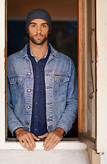 Image showing Fashion, serious and portrait of man by window at his home with casual, trendy and stylish outfit. Handsome, confident and male person with cool denim style with jacket, beanie and shirt at house.