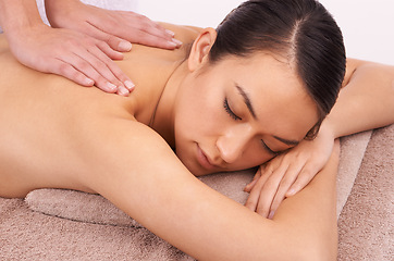 Image showing Hands, zen and woman with back massage at spa for wellness, self care and grooming treatment in studio. Skin, calm and female person with masseuse for body routine on table by white background.