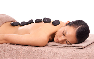 Image showing Health, hot stone and woman with back massage at spa for wellness, self care and grooming treatment in studio. Skin, calm and person with masseuse for warm rock body routine by white background.