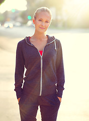 Image showing Happy woman, portrait and city with confidence for fitness, exercise or outdoor workout. Female person, blonde or athlete in proud happiness for health and wellness in the street of an urban town