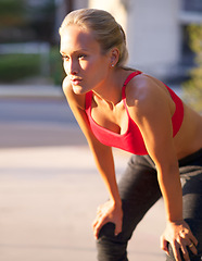 Image showing Woman, fitness and rest with break in city from workout, exercise or outdoor training. Young female person, blonde or athlete in breathing, recovery or health and wellness on street of an urban town