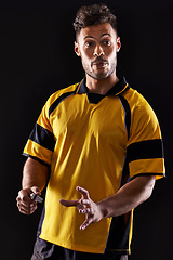 Image showing Face, referee or man with warning, foul call or penalty review in sports, rugby or football game at night. Soccer match, dark or person in studio with discipline, rules or caution on black background