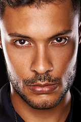 Image showing Portrait, confidence and closeup of man in studio isolated on a black background. Face, serious and skin of a young handsome male person with beard for profile picture on a backdrop in Argentina