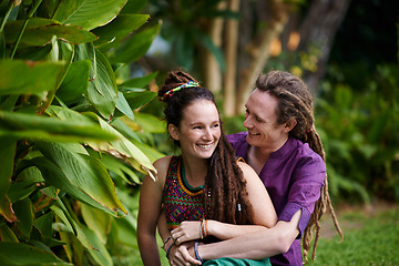 Image showing Nature, hipster and couple hugging in garden on outdoor romantic date together for bonding. Smile, love and happy rasta young man and woman laughing and embracing with care in park or field.