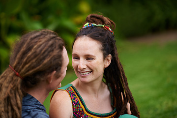 Image showing Nature, hipster and couple in conversation in garden on outdoor romantic date together for bonding. Smile, love and happy young man and woman laughing, relaxing and talking in park or field.