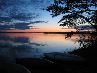 Image showing Canoes at sunset