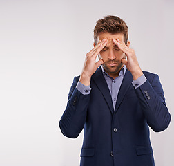 Image showing Entrepreneur, man and studio with stress or headache for company, deadline and corporate person on white background. Frustrated, businessman and work for start up business in suit and professional