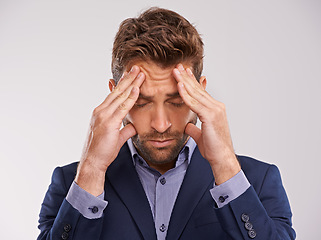Image showing Corporate, man and studio with headache or stress on white background with deadline and business concern. Closeup, entrepreneur and frustrated with start up company, job and professional in suit
