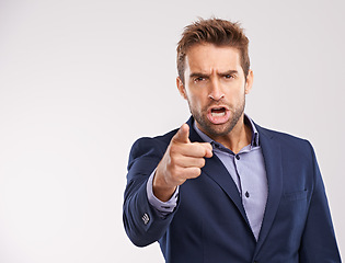 Image showing Entrepreneur, man and shout with pointing in studio white background to blame, angry and disappointed. Portrait, businessman and furious or upset in suit and professional with start up company