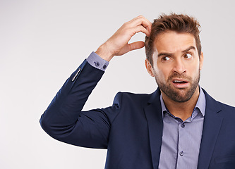 Image showing Confused, businessman and studio portrait worried, puzzled employee with idea for question. Professional, wondering expression for corporate job, thinking and scratching head on isolated background