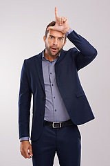 Image showing Portrait, loser gesture and man with business, fail and mistake on a white studio background. Person, employee or entrepreneur with L symbol, emoji or sign with icon or silly with negative expression