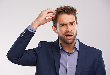 Image showing Confused, businessman and studio portrait uncertain, puzzled employee with idea for question. Professional, wondering expression for corporate job, thinking and scratching head on isolated background