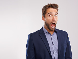 Image showing Shocked businessman, wow or fashion announcement on white background for style, offer or promo. Surprise, entrepreneur or salesman in disbelief with breaking news, clothes deal or studio mockup space