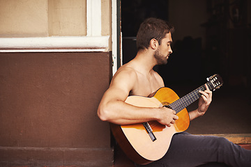 Image showing Guy, guitar or play of music to relax, thinking or planning of creative, vision or idea as dream sound. Man, performance or musical instrument as talent, note or inspiration for acoustic weekend