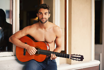 Image showing Guitar, portrait or man in home for music, performance or entertainment with sound, rhythm or talent. Learning solo, topless artist or creative musician playing an instrument for practice routine