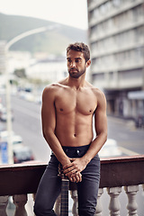 Image showing Sexy, muscles and shirtless man on balcony, natural body and thinking male person with music idea and instrument outside. Confident, topless and abs in summer with guitar, standing in Puerto Rico