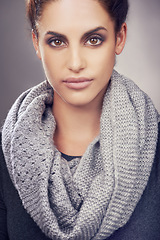 Image showing Serious, scarf and portrait of woman for beauty, fashion and clothes with face isolated on gray background. Female person, gen z girl and student warm for cold weather, cool climate and wool garment