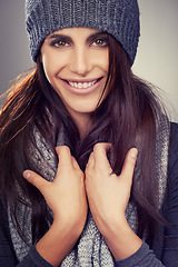 Image showing Woman, studio and portrait of winter fashion, smile and happy female person with wool clothes and cosmetic beauty. Makeup, face and comfort for warm or style on model, confident on background